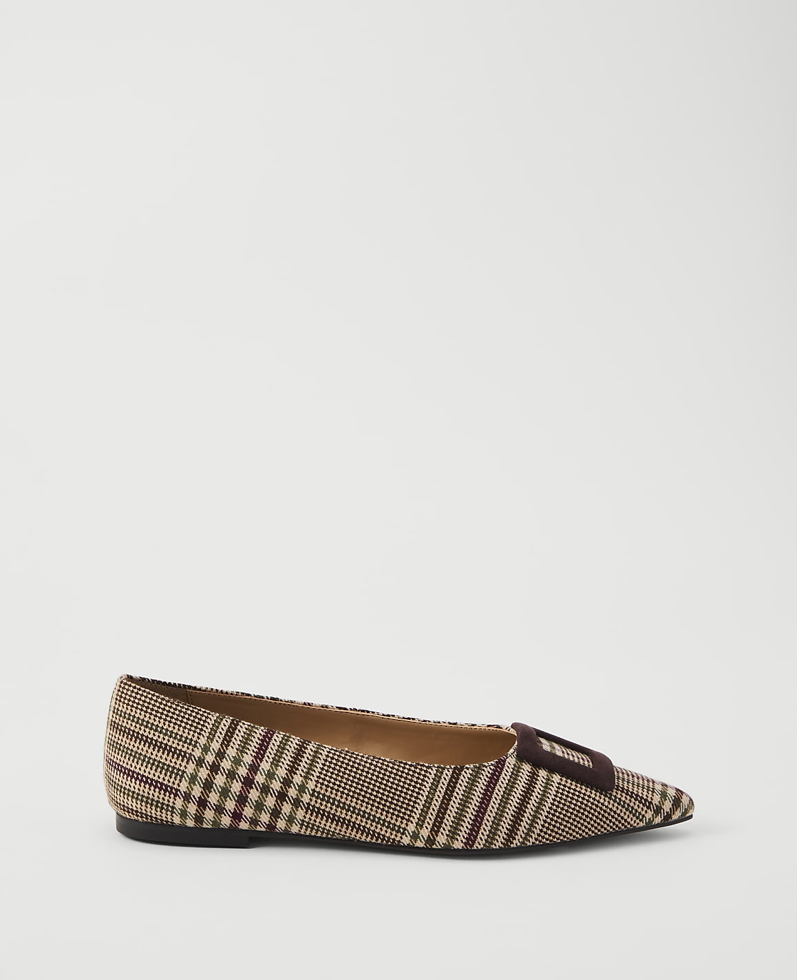 A brown plaid pointed-toe flat shoe with a dark buckle sits on a plain white background.