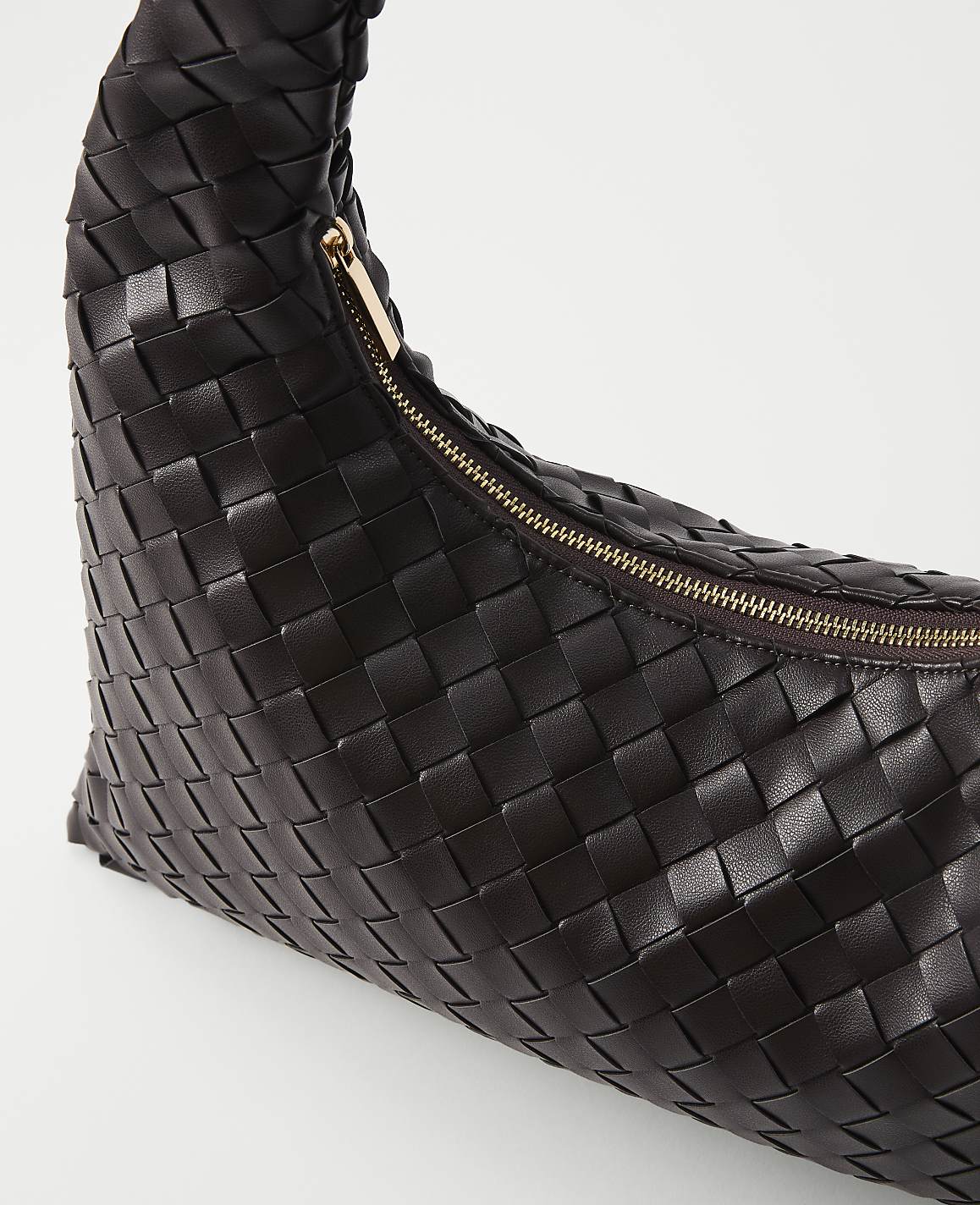 A dark brown woven leather handbag with a gold zipper is presented against a plain white background.