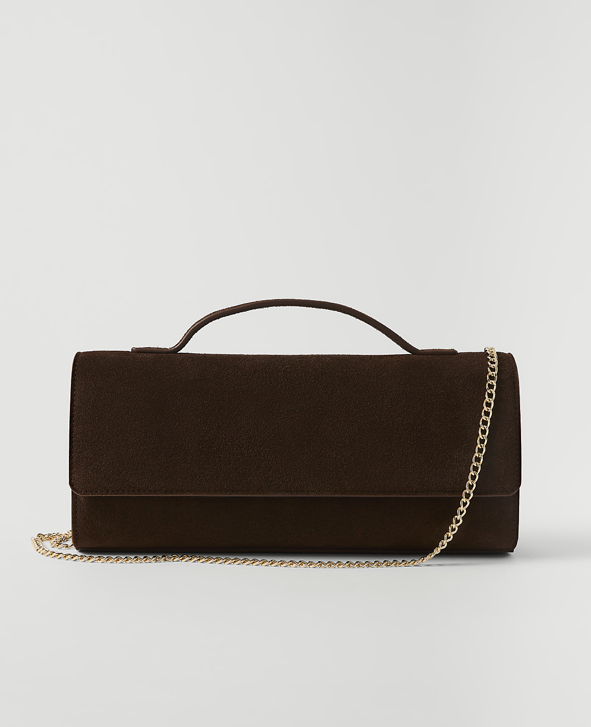 A dark brown textured clutch with a gold chain strap rests on a plain white background.