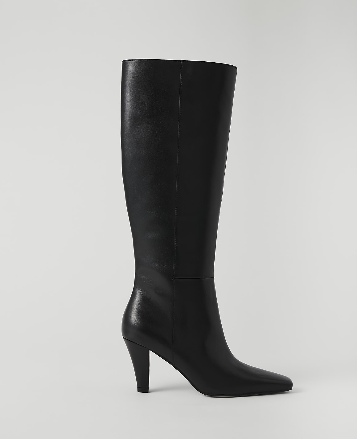 A black leather knee-high boot with a pointed toe and stiletto heel stands against a plain white background.