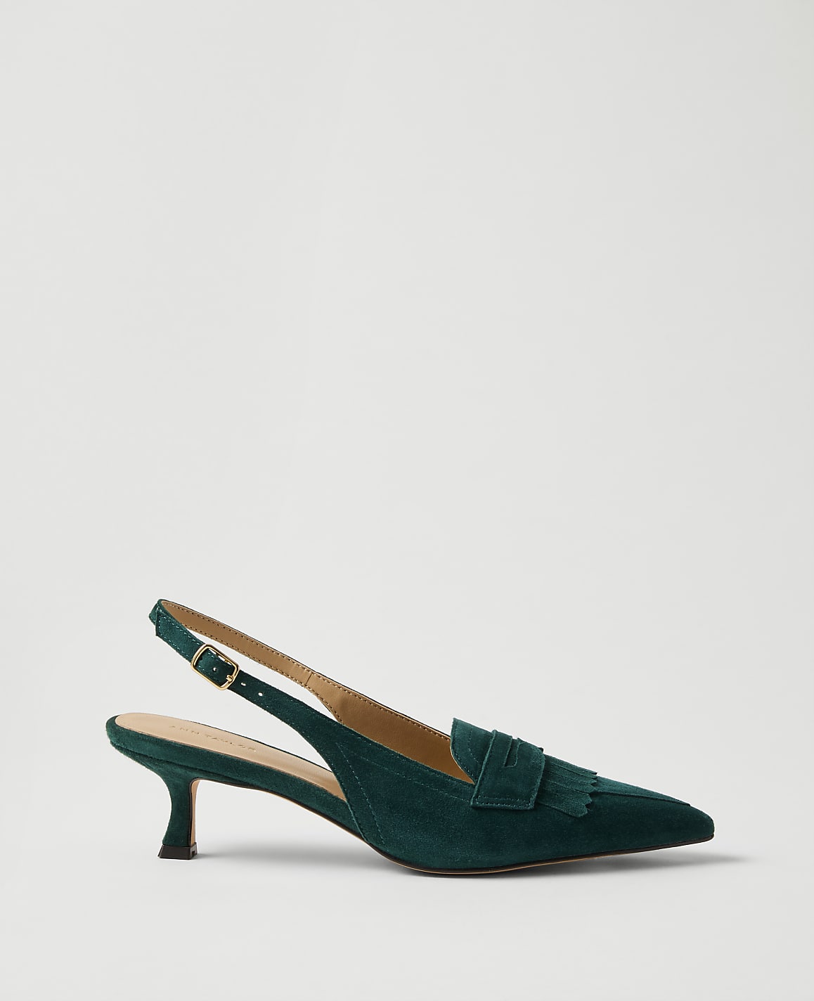 A single dark green suede slingback heel with a bow detail sits against a plain, light grey background.
