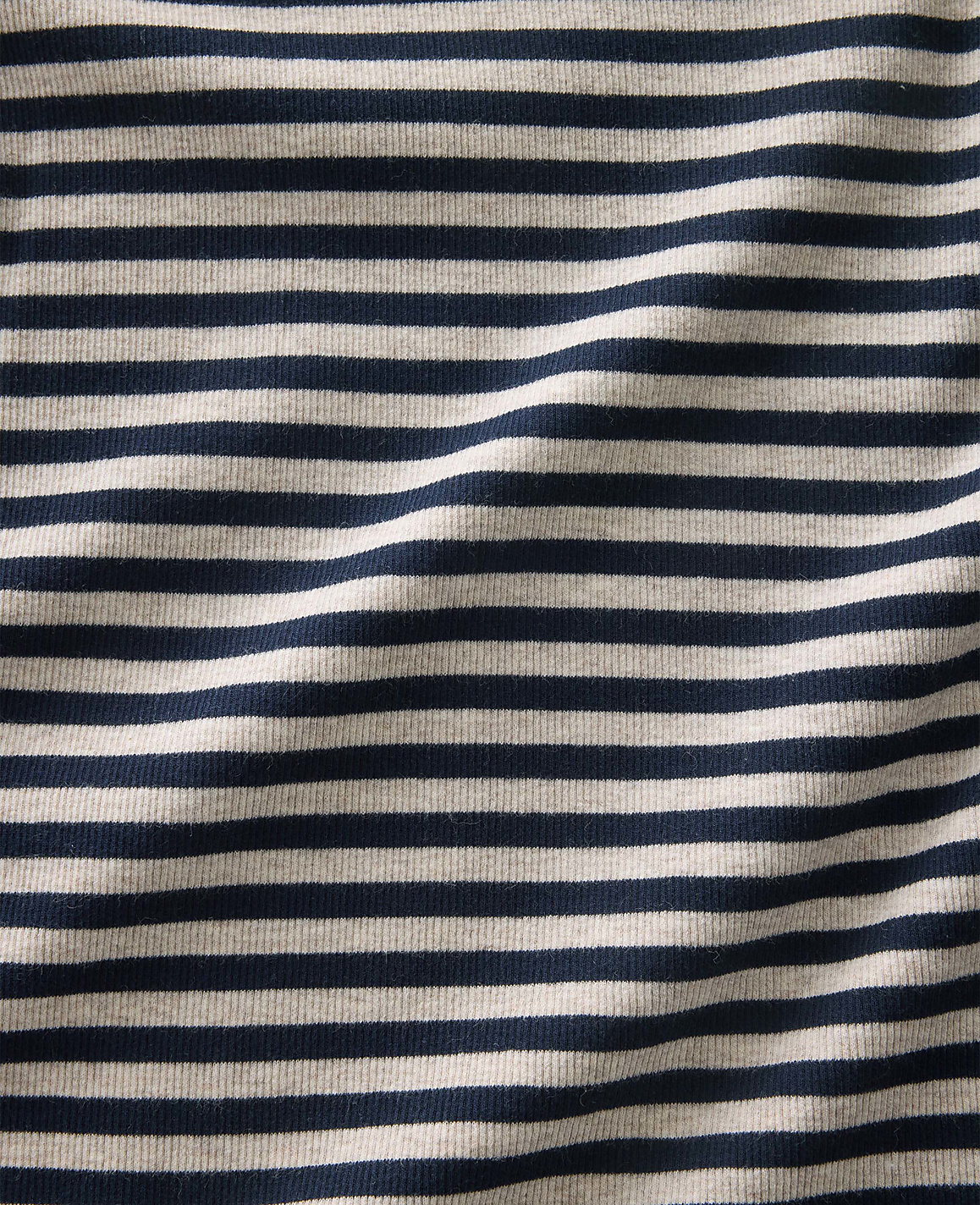 Navy blue and white horizontal stripes ripple across a piece of folded fabric.