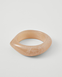 A translucent, peachy-pink bangle with a marbled pattern rests on a plain white background. carousel Product Image 1