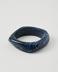 A dark blue, marbled bangle rests on a plain white background. carousel Product Image 1