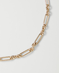 A delicate rose gold chain with alternating oval and elongated oval links curves across a plain white background. carousel Product Image 2
