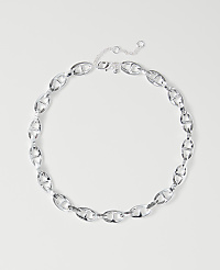 A silver chain necklace with oval links lies on a plain white background. carousel Product Image 1