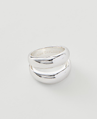 A silver Ann Taylor ring with a smooth, rounded design rests on a plain white background. carousel Product Image 1