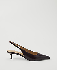 A glossy, dark brown slingback kitten heel rests on a plain white background. carousel Product Image 1