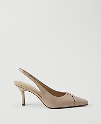 A nude leather slingback heel with a gold buckle detail rests on a plain white background. carousel Product Image 1