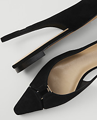 A pair of black suede slingback heels with pointed toes are laid out on a white background. carousel Product Image 2