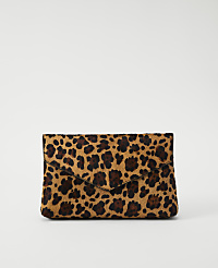 A leopard-print clutch rests on a plain white background. carousel Product Image 1