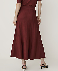 A person wearing a maroon knit midi skirt and black slingback heels stands against a plain white background. carousel Product Image 3
