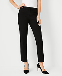 A woman in black pants and heels stands against a plain white background. carousel Product Image 1