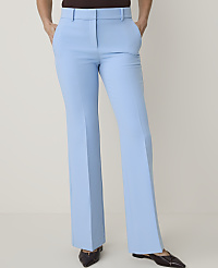 Light blue flared trousers with dark shoes are displayed against a plain white background. carousel Product Image 1