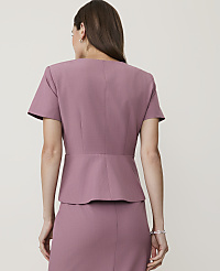 A woman in a mauve peplum jacket and skirt stands against a plain, light-colored background. carousel Product Image 2