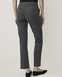 A person wearing dark gray slacks and black flats stands against a plain, light gray background. carousel Product Image 2