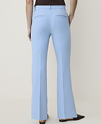 A person wearing light blue flared pants and dark shoes stands against a plain, light background. carousel Product Image 3