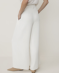 A person in white wide-leg pants stands against a plain white background. carousel Product Image 3