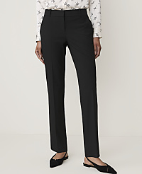 A person stands in black trousers and a patterned blouse, with a plain white background. carousel Product Image 2