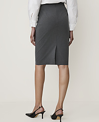 A woman in a grey pencil skirt and white blouse stands against a plain, light-colored background, wearing black slingback heels. carousel Product Image 3