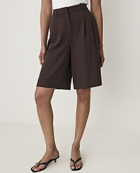 A person stands in brown culottes and black sandals against a plain white background. carousel Product Image 2