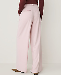 A person wearing pink wide-leg pants and a maroon sweater stands against a plain white background. carousel Product Image 3