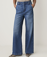A person wearing wide-leg denim jeans stands against a plain white background. carousel Product Image 2