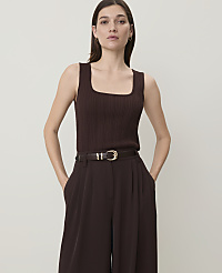 A woman in a brown ribbed tank top and wide-leg pants stands against a plain, light background. carousel Product Image 1
