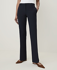 A person stands in dark blue dress pants and brown flats against a plain, light-colored background. carousel Product Image 2