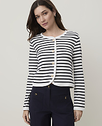 A woman in a striped cardigan and dark pants stands against a plain, light background. carousel Product Image 1