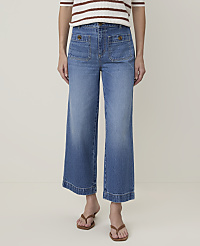 A person wearing wide-leg denim jeans and brown sandals stands against a plain white background. carousel Product Image 2