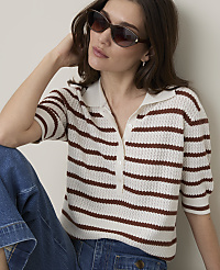 A woman in a striped polo shirt and jeans poses against a plain background. carousel Product Image 3