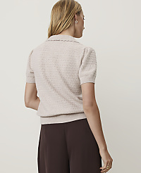 A woman in a beige collared shirt and brown pants stands against a plain, light-colored background. carousel Product Image 2