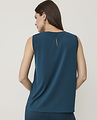 A woman in a teal sleeveless top and matching pants stands against a plain, light-colored background. carousel Product Image 2