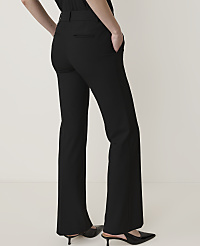 A person in black flared trousers and pointed heels stands against a plain white background. carousel Product Image 3
