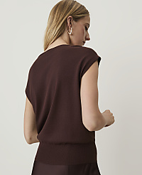 A woman in a brown sweater is shown from the back against a plain, light background. carousel Product Image 2