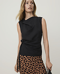 A woman in a black sleeveless top and a leopard print skirt stands against a plain white background. carousel Product Image 1