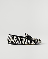 A zebra-print loafer rests on a plain white background. carousel Product Image 1