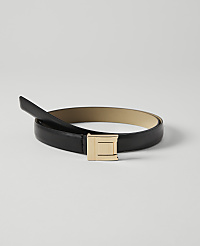 A black leather belt with a gold buckle lies on a plain white background. carousel Product Image 1