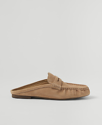 A tan suede mule loafer rests on a plain, light gray background. carousel Product Image 1
