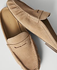 A pair of tan suede loafers with visible stitching rests on a plain white background. carousel Product Image 2