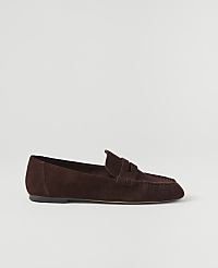 A brown suede loafer rests on a plain white background. carousel Product Image 2