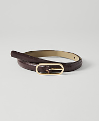A dark brown, croc-embossed leather belt with a gold oval buckle lies coiled on a plain white background. carousel Product Image 1