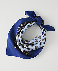 A blue silk bandana with a patterned center is laid flat against a plain white background. carousel Product Image 1