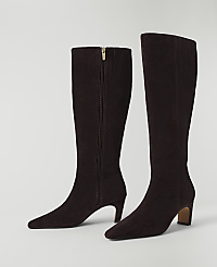 A pair of dark brown suede knee-high boots with a zipper detail stand on a plain white background. carousel Product Image 2
