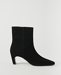 A black suede ankle boot with a pointed toe and a low heel stands against a plain white background. carousel Product Image 1