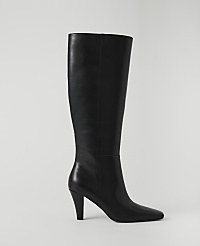 A black leather knee-high boot with a pointed toe and stiletto heel stands against a plain white background. carousel Product Image 1