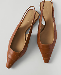 A pair of brown croc-embossed slingback heels rests on a plain white background. carousel Product Image 1