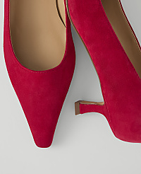A close-up of two vibrant red suede pointed-toe heels with a light background. carousel Product Image 2