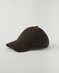 A brown and black checkered baseball cap rests on a plain white background. carousel Product Image 1